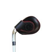 Studio shot of leather magnetic golf iron covers in black with red edges neatly arranged to showcase their smooth texture, precise stitching, and minimalist design under soft lighting.