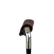 Studio shot of leather magnetic golf iron covers in brown neatly arranged to showcase their smooth texture, precise stitching, and minimalist design under soft lighting.